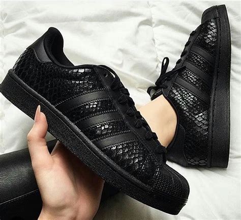 solid black sneakers